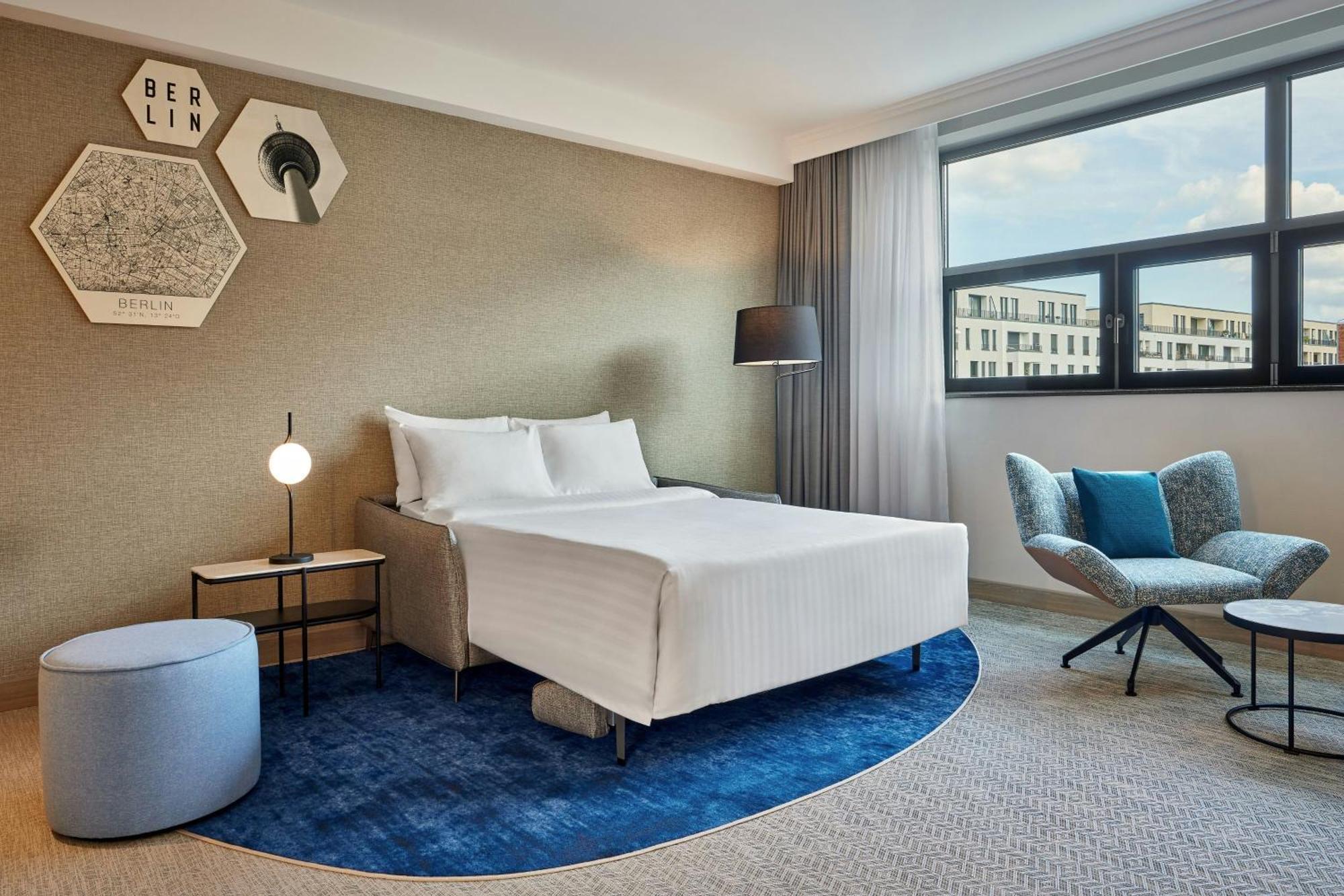 Apartment mit einem Schlafzimmer mit Kingsize-Bett und Schlafsofa